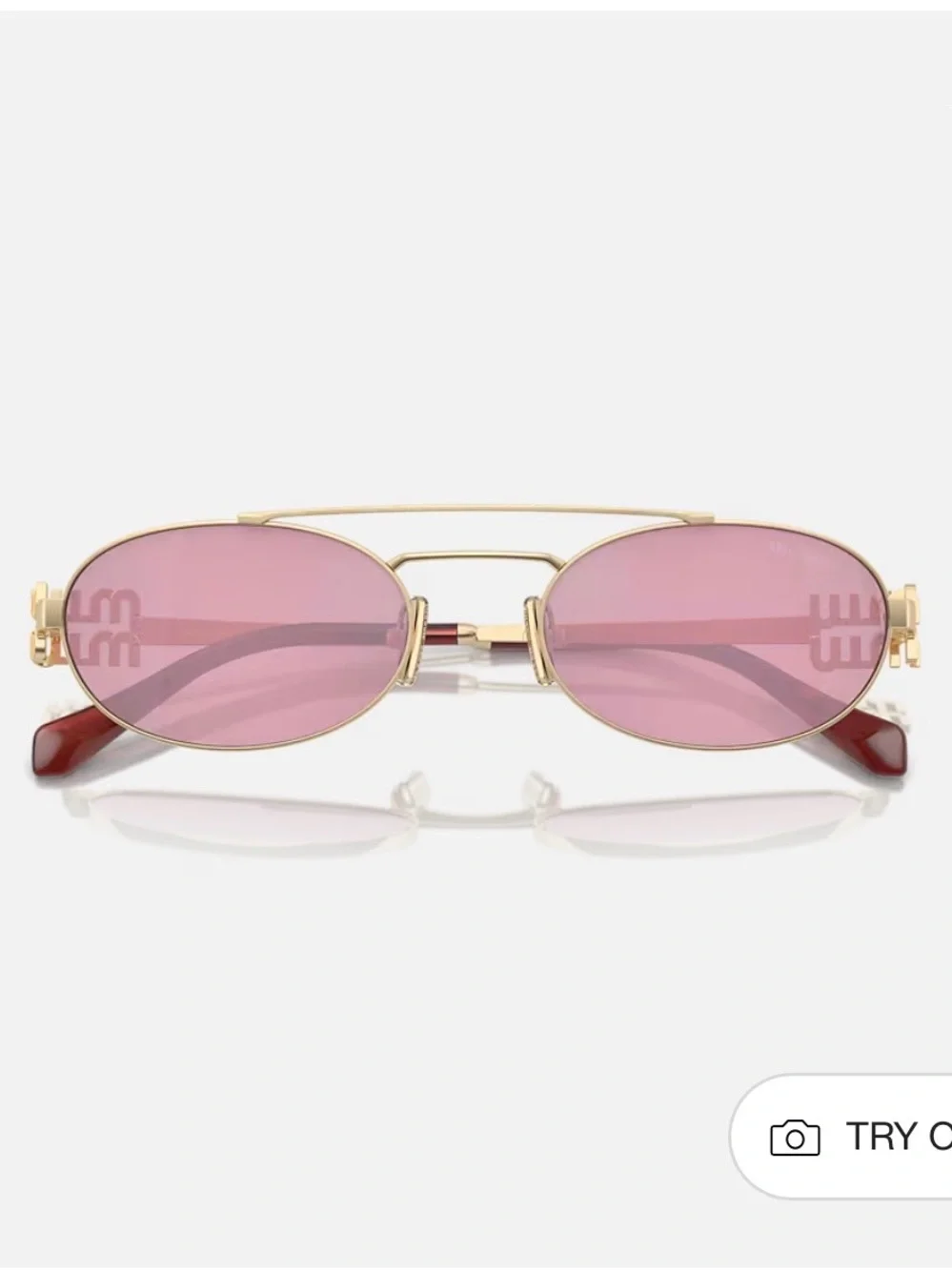 Miu Miu Gold Frame Sunglasses with Pink Lenses